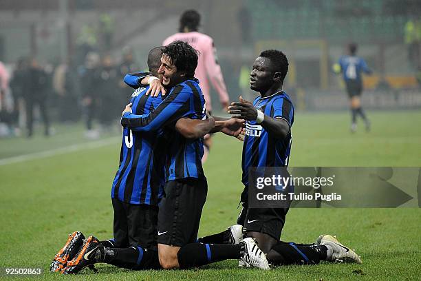 Maicon, Diego Milito and Sulley Muntari of Inter Milan celebrate their 5th goal during the Serie A match between FC Internazionale Milano and US...