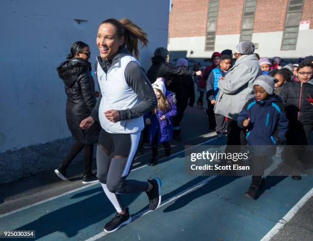 Elite Athlete Lolo Jones participates in PHIT America's Morning Mile Program with students at Michael J. Perkins Elementary School on February 27,...