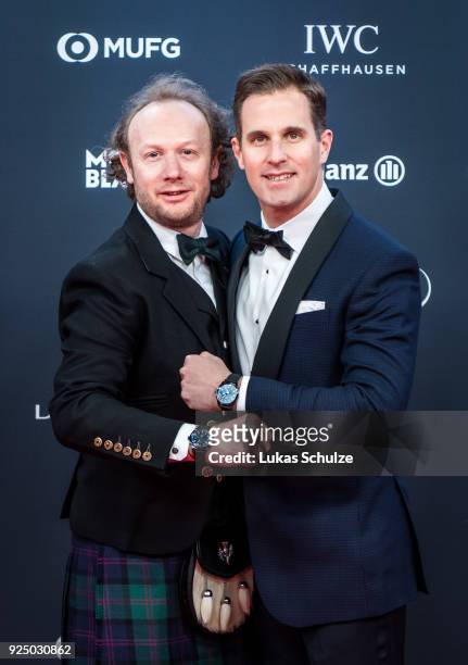Andrew Thomas and Christoph Grainger-Herr, CEO of IWC Schaffhausen, attend the 2018 Laureus World Sports Awards at the Salle des Etoiles, Sporting...