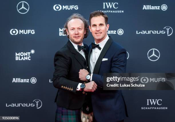 Andrew Thomas and Christoph Grainger-Herr, CEO of IWC Schaffhausen, attend the 2018 Laureus World Sports Awards at the Salle des Etoiles, Sporting...