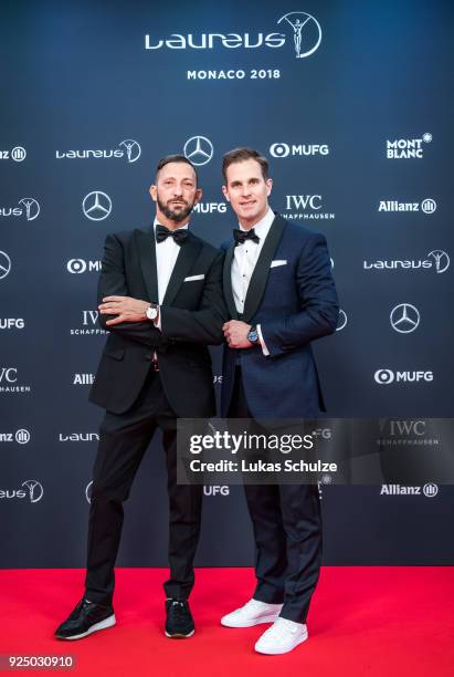 Harris Davlas and Christoph Grainger-Herr, CEO of IWC Schaffhausen, attend the 2018 Laureus World Sports Awards at the Salle des Etoiles, Sporting...