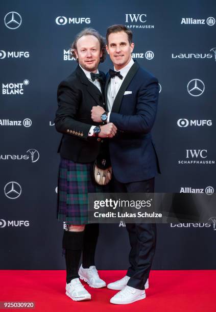 Andrew Thomas and Christoph Grainger-Herr, CEO of IWC Schaffhausen, attend the 2018 Laureus World Sports Awards at the Salle des Etoiles, Sporting...