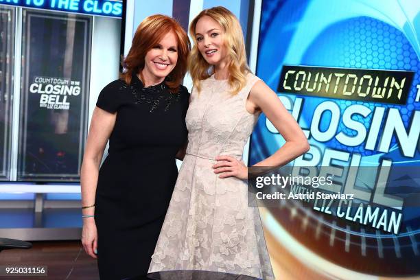 Liz Claman poses for photos with actress Heather Graham during a taping of "Countdown To Closing Bell With Liz Claman" at Fox Business Network...