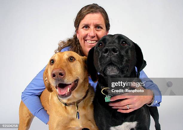 family portrait of woman and her dogs - renphoto stock pictures, royalty-free photos & images