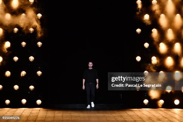 Designer Anthony Vaccarello acknowledges the applause of the audience after the Saint Laurent show as part of the Paris Fashion Week Womenswear...