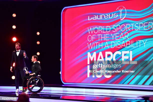 Laureus Academy Member Fabian Cancellara speaks on stage as he gives Marcel Hug the award for Laureus World Sportsperson of the Year with a Disabilty...