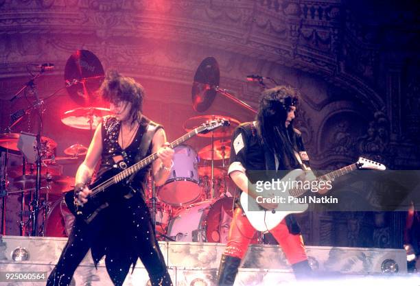 Motley Crue performing at the Rosemont Horizon in Rosemont, Illinois, November 1, 1985. Nikki Sixx, left, and Mick Mars are visible on stage.