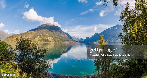 panoramic shot of briksdalsbreen glacier, norway on a bright summer evening - olden foto e immagini stock