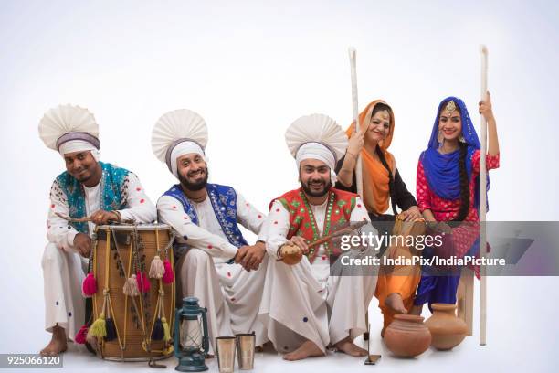 sikh people posing - people celebrate lohri festival stock-fotos und bilder