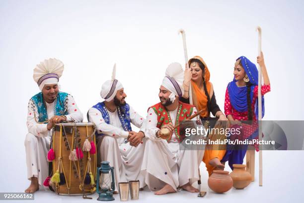 sikh people posing - people celebrate lohri festival stock-fotos und bilder