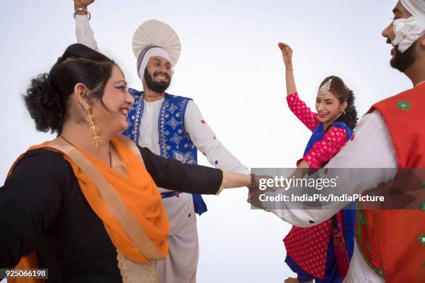 sikh people dancing - north indian food stock pictures, royalty-free photos & images