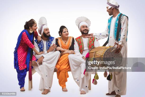 sikh people posing - people celebrate lohri festival stock pictures, royalty-free photos & images