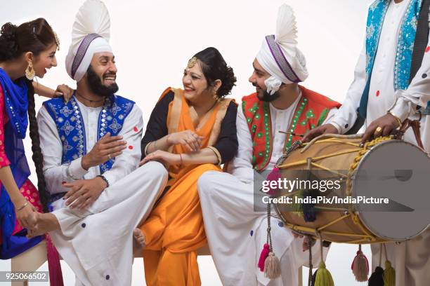 sikh people posing - people celebrate lohri festival stock pictures, royalty-free photos & images