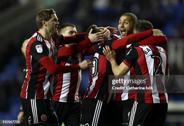 Billy Sharp of Sheffield United celebrates with teammates Leon Clarke and George Baldock after scoring the opening goal during the Sky Bet...