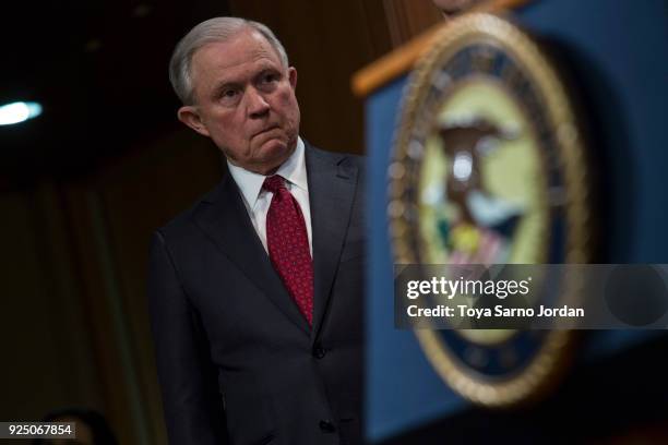 Attorney General Jeff Sessions listens during a press conference at the Department of Justice in Washington, DC on February 27, 2018. Sessions...