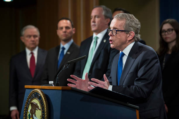 Ohio Attorney General Mike DeWine speaks during a press conference at the Department of Justice in Washington, DC on February 27, 2018.Sessions...
