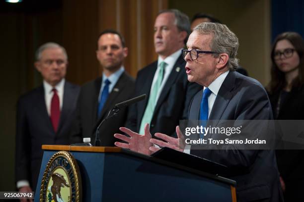 Ohio Attorney General Mike DeWine speaks during a press conference at the Department of Justice in Washington, DC on February 27, 2018.Sessions...