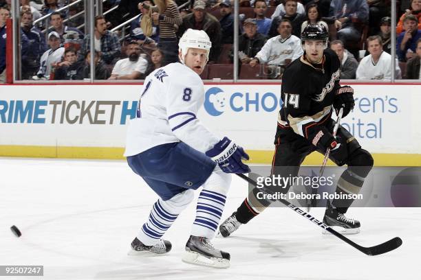 Mike Komisarek of the Toronto Maple Leafs watches the puck against Joffrey Lupul of the Anaheim Ducks during the game on October 26, 2009 at Honda...