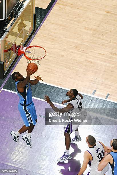Desmond Mason of the Utah Jazz lays up a shot against Mehmet Okur of the Sacramento Kings during the preseason game on October 23, 2009 at Arco Arena...