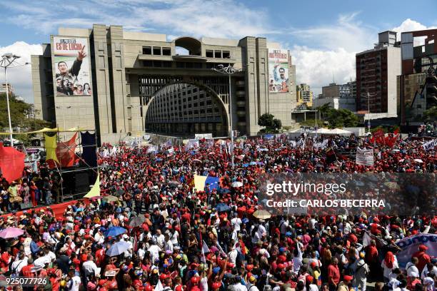 Supporters of Venezuelan President Nicolas Maduro attend a rally at Diego Ibarra square in Caracas, after Maduro submitted his presidential...