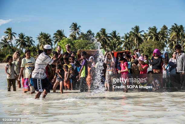 An Imam blesses members of the Bajau Laut tribe during a water festival held annually by the inhabitants of kalapuan Island. The festival is a...