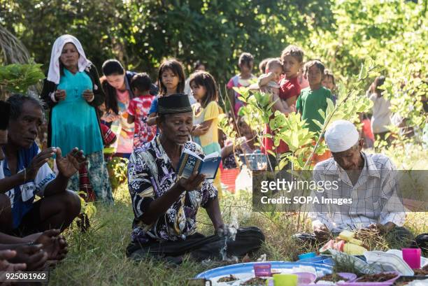 Bajau Imam reads from the Koran during a water festival held annually by the inhabitants of kalapuan Island. The festival is a purification ritual...