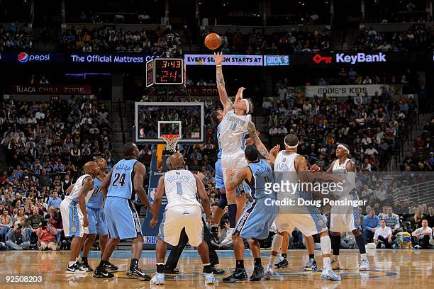 Chris Andersen of the Denver Nuggets wins a tip off against Mehmet Okur of the Utah Jazz during NBA action at Pepsi Center on October 28, 2009 in...