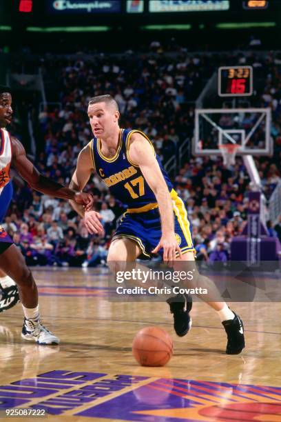 Chris Mullin of the Golden State Warriors dribbles during a game on January 9, 1994 at America West Arena in Phoenix, Arizona. NOTE TO USER: User...