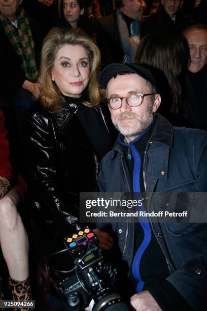 Catherine Deneuve and Loic Prigent attend the Saint Laurent show as part of the Paris Fashion Week Womenswear Fall/Winter 2018/2019 on February 27,...