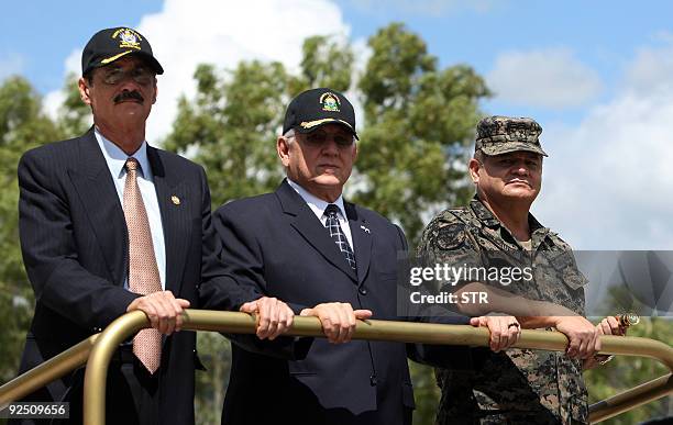 Honduran Defence Minister Adolfo Leonel Sevilla, de facto leader Roberto Micheletti and the Chief of the Honduran Armed Forces, General Romeo...