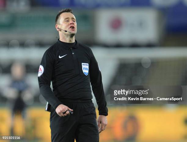 Referee Stuart Attwell during the The Emirates FA Cup Fifth Round Replay match between Swansea City and Sheffield Wednesday at Liberty Stadium on...