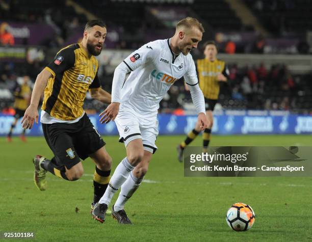 Swansea City's Mike van der Hoorn under pressure from Sheffield Wednesday's Atdhe Nuhiu during the The Emirates FA Cup Fifth Round Replay match...