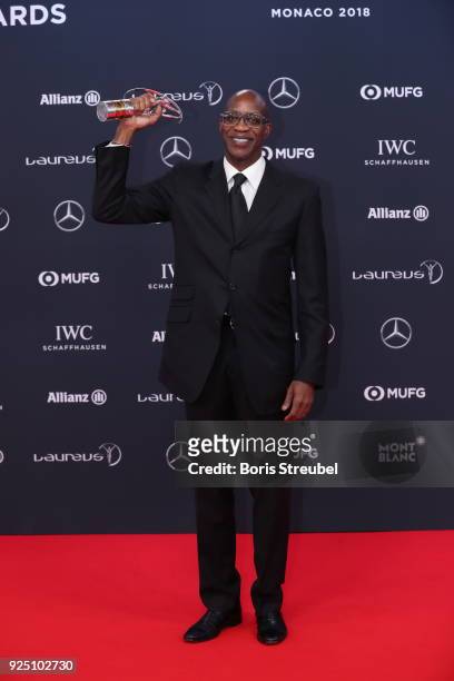 Laureus Academy Member Edwin Moses holds their award for Lifetime Achievement at Salle des Etoiles, Sporting Monte-Carlo on February 27, 2018 in...