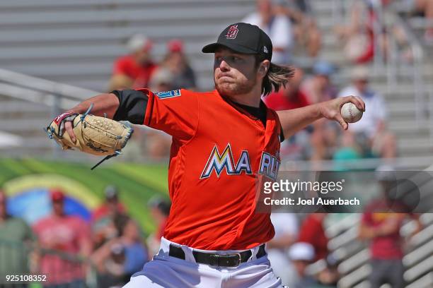 Dillon Peters of the Miami Marlins throws the ball against the St Louis Cardinals during a spring training game at Roger Dean Chevrolet Stadium on...