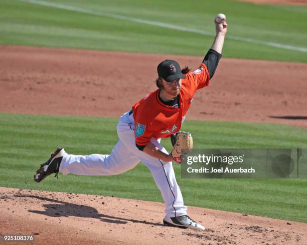 Dillon Peters of the Miami Marlins throws the ball against the St Louis Cardinals during a spring training game at Roger Dean Chevrolet Stadium on...