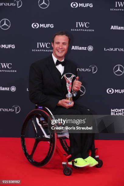 Marcel Hug holds their Laureus award at Salle des Etoiles, Sporting Monte-Carlo on February 27, 2018 in Monaco, Monaco.