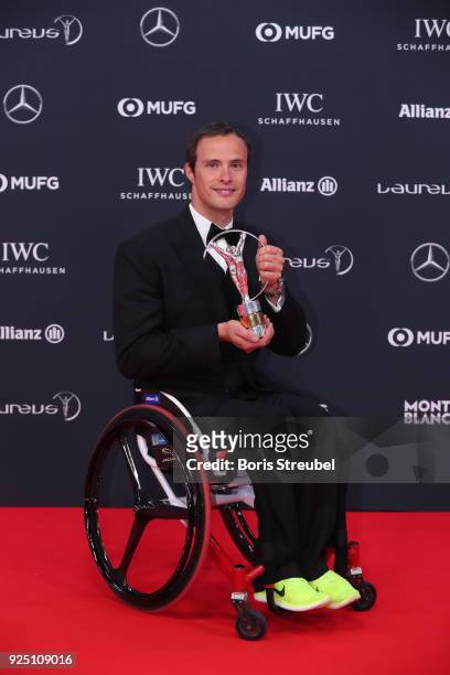 Marcel Hug holds their Laureus award at Salle des Etoiles, Sporting Monte-Carlo on February 27, 2018 in Monaco, Monaco.