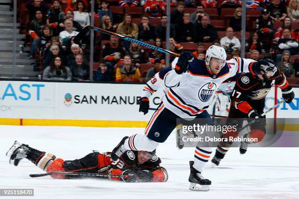 Oscar Klefbom of the Edmonton Oilers races for the puck with pressure from Jakob Silfverberg of the Anaheim Ducks during the game on February 25,...