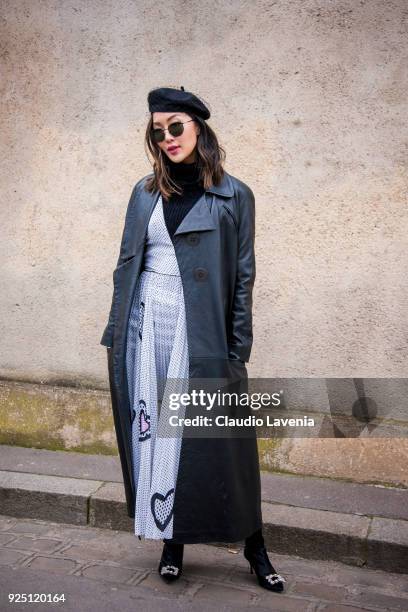Chriselle Lim is seen wearing a black french hat and a black and white dress in the streets of Paris after the Dior show during Paris Fashion Week...