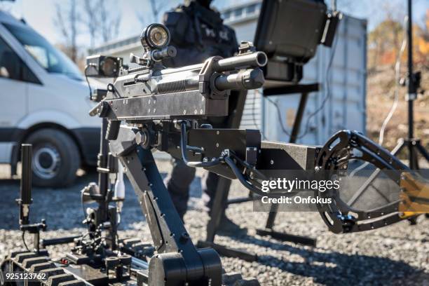 police swat officer using a mechanical arm bomb disposal robot unit - bomb squad stock pictures, royalty-free photos & images