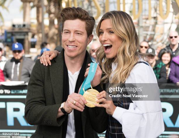 Renee Bargh holds Shaun White's gold medal at "Extra" at Universal Studios Hollywood on February 27, 2018 in Universal City, California.