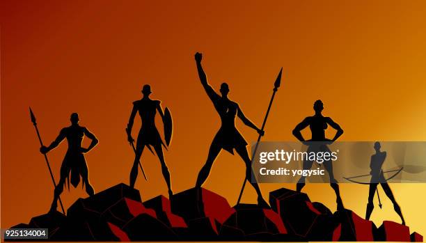 vector african women superhero team silhouettes on rocks - spear stock illustrations
