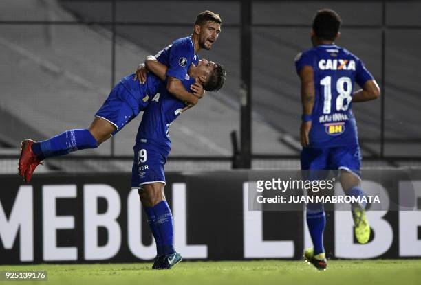 Brazil's Cruzeiro midfielder Giorgian De Arrascaeta celebrates with teammate midfielder Lucas Romero after scoring a goal against Argentina's Racing...