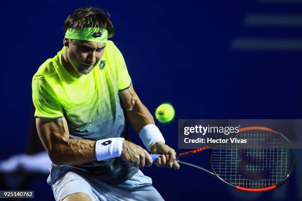 David Ferrer of Spain takes a backhand shot during the match between David Ferrer of Spain and Andrey Rublev of Russia as part of the Telcel Mexican...