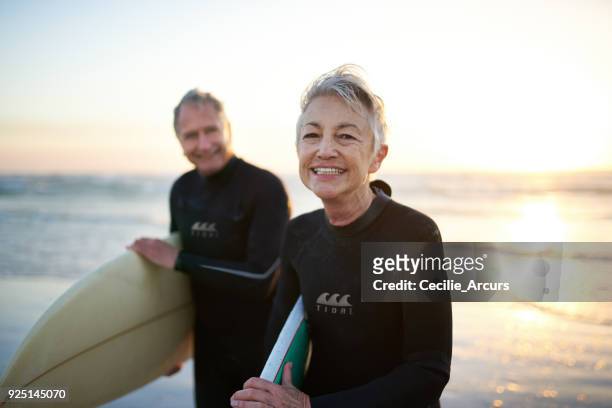 the perfect way to spend their free time - prancha de surf imagens e fotografias de stock