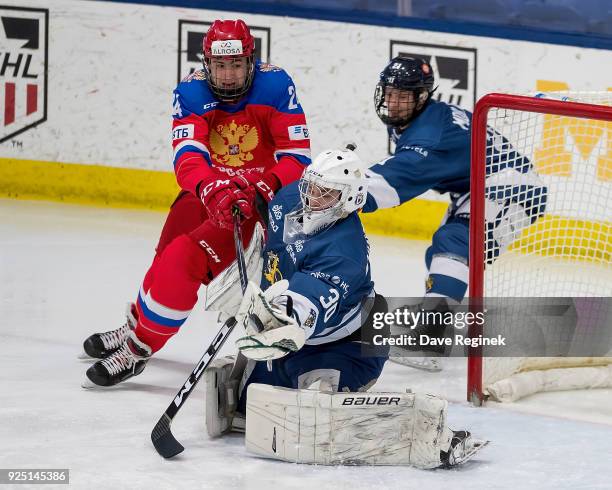 Jere Huhtamaa of the Finland Nationals makes a glove save in front of Yegor Sokolov of the Russian Nationals during the 2018 Under-18 Five Nations...