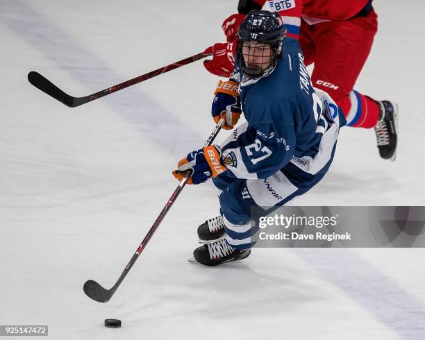 Kristian Tanus of the Finland Nationals skates up ice with the puck against the Russian Nationals during the 2018 Under-18 Five Nations Tournament...