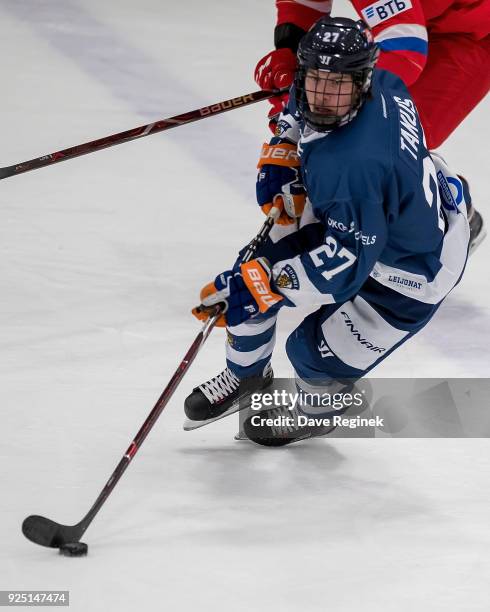Kristian Tanus of the Finland Nationals skates up ice with the puck against the Russian Nationals during the 2018 Under-18 Five Nations Tournament...
