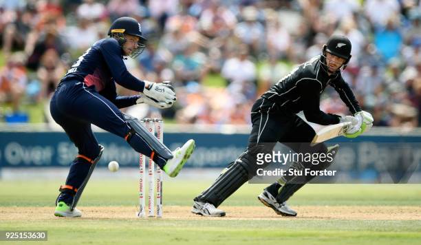 New Zealand batsman Martin Guptill cuts a ball towards the boundary watched by Jos Buttler uring the 2nd ODI between New Zealand and England at Bay...