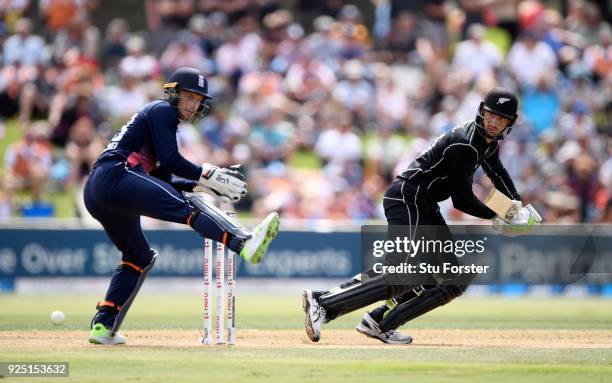 New Zealand batsman Martin Guptill cuts a ball towards the boundary watched by Jos Buttler uring the 2nd ODI between New Zealand and England at Bay...